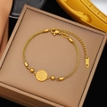 Gold stainless steel bracelet with Fu character pendant and beads in a jewelry box - Gold Stainless Steel Fu Charm Double Bracelet (SLE189)