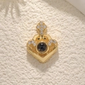 Golden heart projection necklace with crown detail and small diamonds on beige background - Heart