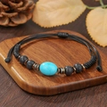 Adjustable woven bracelet with blue turquoise stone and black volcanic beads on wood stand - ZJ14874-Turquoise Lava Stone Woven Bracelet