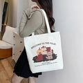 White canvas tote bag featuring colorful kitten graphics and Welcome to the Fold text - Cute Pet Family