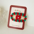 Handmade red and green knitted hair clip with white pearl detail on card display - Christmas Pearl Bow