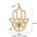 Golden Hamsa hand charm with white micro-pave stones and blue turquoise center - M599219-turquoise / Turquoise