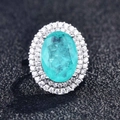 Macro view of pear-cut Paraiba tourmaline ring with double halo pavé diamonds - Adjustable Open / Style G-Paraiba Oval Halo