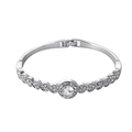 Macro shot of silver heart-shaped alloy bracelet featuring round crystal and pavé stones - Silver