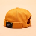 Mustard yellow cotton docker hat featuring a black rectangular street style woven label - Peeping Label Yellow