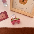 Handmade red strawberry plaid fabric hair scrunchie with cute bunny charm on display - Red