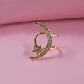 Gold star and moon clip-on earring with sparkling cubic zirconia on pink background - Gold