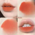 Matte velvet lip mud in shade 03 Warm with a soft warm orange finish on lips - 03# Warm Orange