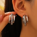 Silver C-shaped hoop earrings with layered crystal inlay for women's elegant fashion - Silver Tone Intertwined Zirconia Style (3507)