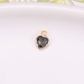 Classic heart-shaped crystal pendant with gold copper edging in dark grey faceted stone - Gray