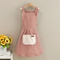 Detail of red striped apron with beige towel pocket and ruffles on hangers - Striped Princess Style-Towel Pocket Red