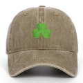 Detail of green clover embroidery on vintage washed canvas baseball cap fabric - Khaki