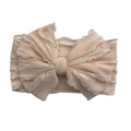 Elastic baby headband with large layered bow in soft peach nude color with ribbed fabric - Beige