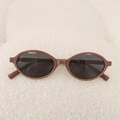 Retro oval children's sunglasses with dark brown frames and black lenses on white plush - Coffee