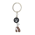 Detailed view of metal dog keychain with paw print, bone charm, and cocker spaniel pendant - Springer Spaniel