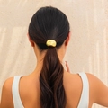 Chic metallic gold elastic hair tie with irregular textured finish on a ponytail - Gold Wrinkled (0560)