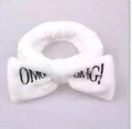 White plush bow headband with OMG embroidery for women skincare and washing face - White