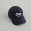 Detailed close-up of navy blue cotton baseball cap with white 3D letter embroidery - 52-54cm (3-8 Years) / Navy Blue