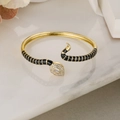 Macro shot of gold snake bracelet with black enamel, pave zircon and water-drop main stone - Black Enamel (31225)
