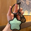 Star-shaped leather keychain pendant in light green and black with black spring ring - Leather-Green Star