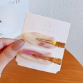 Set de dos horquillas de resina mármol rosa con clips de pico de pato dorados - Mármol Rosa (Paquete de 2)