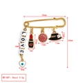 Detail view of a 50mm gold safety pin with Evil Eye, LOVE beads, and charms on white background - LOVE Style (BE1729RD00)