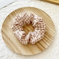 Brown and white gingham plaid scrunchie hair tie displayed on a natural wooden tray - Light Brown Plaid