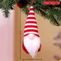 Christmas gnome ornament with red striped knit hat and white beard on a tree branch - Style G
