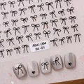Minimalist black bow and heart nail stickers with elegant metallic foil accents - Aha-9401 Black Bows