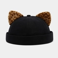 Detail of black docker hat featuring leopard print plush animal ears and canvas texture - Black