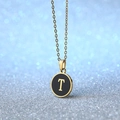 Elegant gold-plated necklace featuring a round black enamel pendant with gold letter T - Letter T