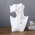 White mannequin bust jewelry display stand featuring golden necklace and round earrings - Half Face Mannequin