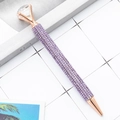 Stylo à bille or rose avec strass violets et cristal en forme de gros diamant - Violet