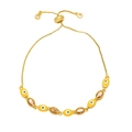 Detail of gold evil eye bracelet with yellow enamel and champagne gemstones on square chain - Orange