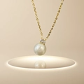 Baroque pearl necklace with gold chain and clear gemstone pendant on light pedestal - [H1024] Zircon Pearl Gold