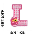 Close-up of letter L embroidery patch with pink checkered pattern and chick detail - Letter L