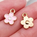 Pink enamel gold flower charms on fingertips showing front and textured back details - Pink Daisy (12253)