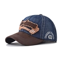 Detail view of washed denim baseball cap with vintage embroidery and suede brim - Adjustable / Navy Blue