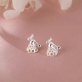Silver shuttlecock stud earrings with polished metallic finish on purple silk background - Badminton Hollow Style (A197)