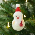 Plush Santa Claus ornament with red hat and heart detail on a Christmas tree - Santa Claus