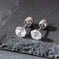 Macro view of 5mm cubic zirconia stud earrings with silver-tone four-prong setting - 5mm / Silver