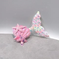 Close-up of sequined mermaid tail, pink shell, and glitter starfish hair accessories - Light Rainbow Mermaid