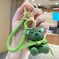 Green resin knit-textured bear keychain with leather loop and golden metal ring - Sitting Knit Resin Bear-Green