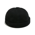 Detail view of a black cotton Miki Hat featuring a classic rolled edge and top button - M(56-58cm) / Black