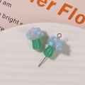 Detail of blue spotted mushroom charms on a white tray for handmade jewelry DIY - No.11 (Lavender Cap Light Blue Dot Green Stem)