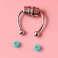 Macro detail of silver magnetic horseshoe nose ring with blue replacement beads on pink backdrop - Magnetic Nose Ring with Green Rubber Ball / Silver/Green