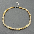 Detailed close-up of natural agate beaded necklace with silver lobster clasp and extension chain - Natural Agate