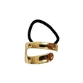 Detail of gold-colored irregular alloy hair tie with black elastic band in punk style - Hollow Asymmetric Geometric