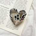 Detail of silver heart phone stand with liquid metal texture and mirror finish - Silver Heart Mirror