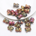 Macro detail of 3D bear crystal pendants with iridescent rainbow metallic finish for DIY - Frosted Brilliant Purple